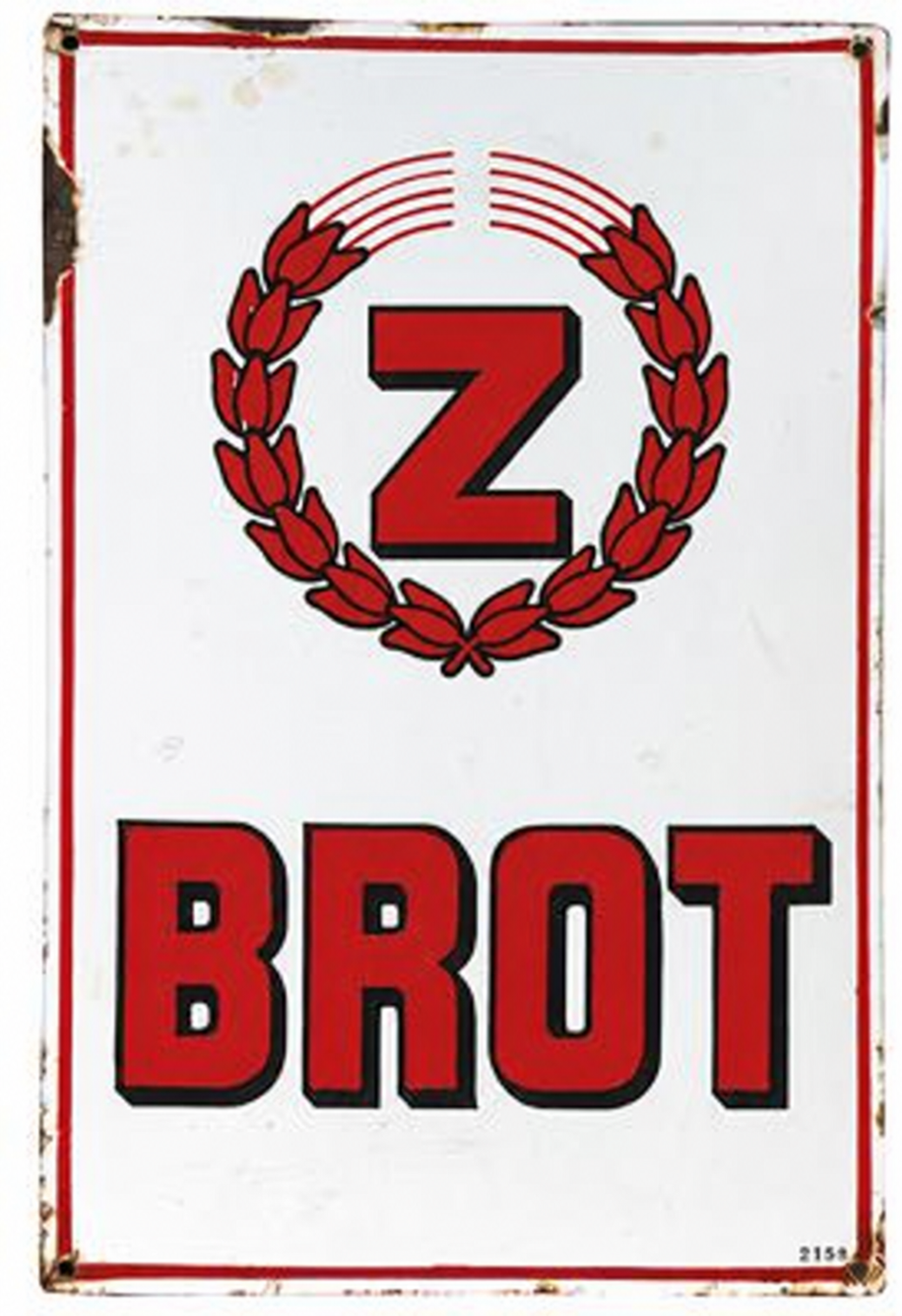 A weathered red and white Brot sign with a wheat wreath.